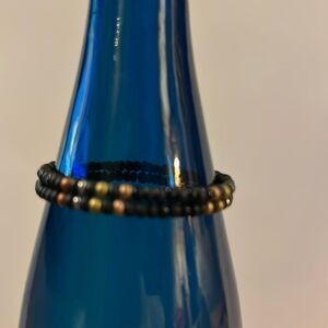 Black beaded bracelet with metallic beads